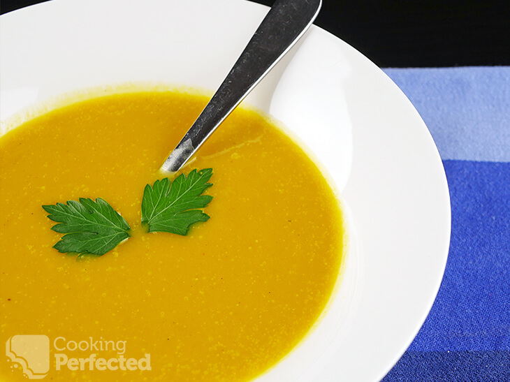 Paleo-Friendly Pumpkin Soup topped with Parsley