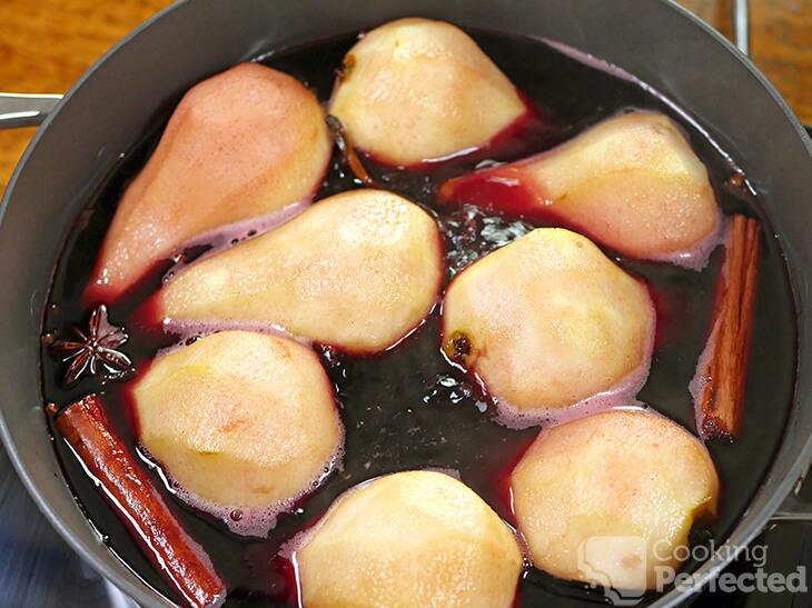 Pears poaching in red wine and spices