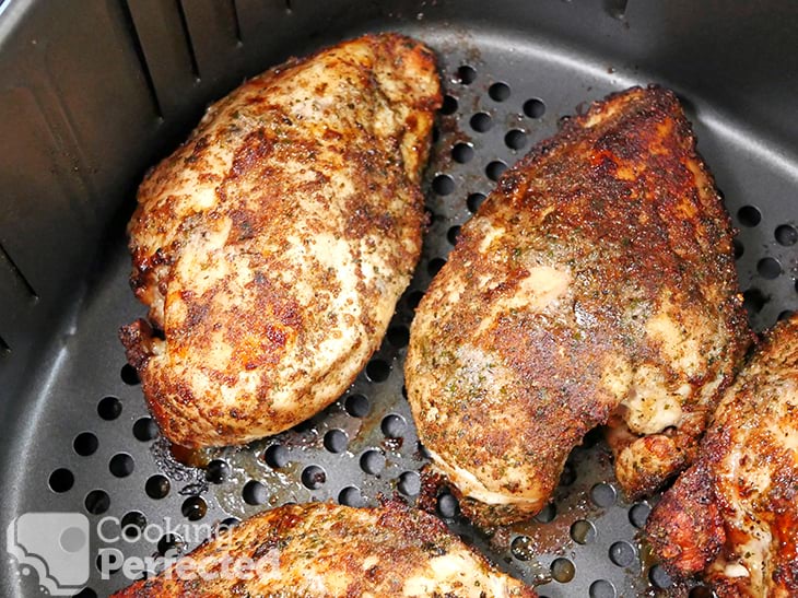 Seasoned Boneless Chicken Breasts Cooking in the Air Fryer