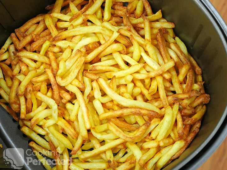 Frozen French Fries cooking in the Air Fryer