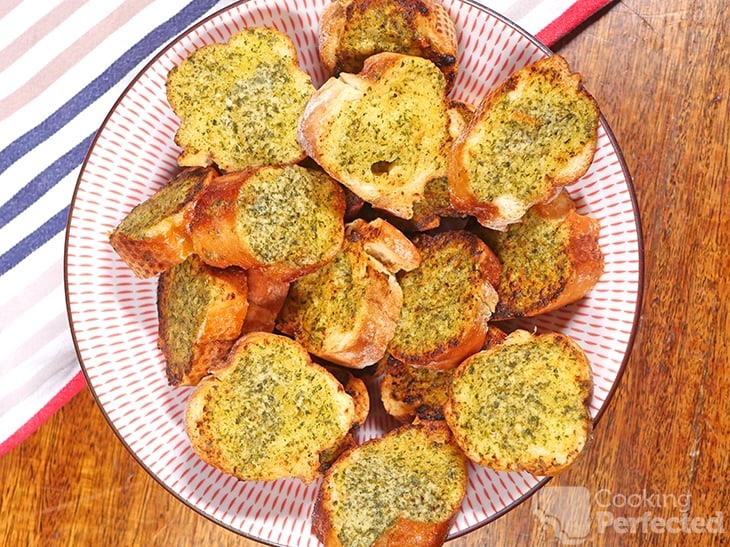 Herby air-fried garlic bread in a bowl