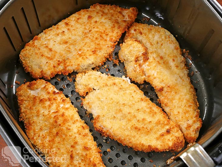 Cooking chicken schnitzels in the air fryer.