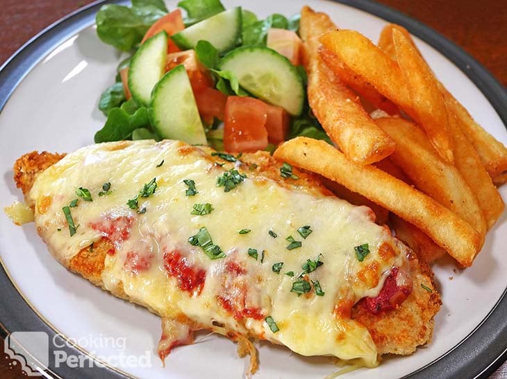 Air fried chicken parmesan with fries and salad