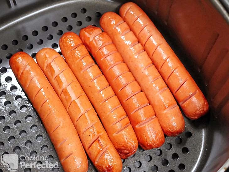 Hot dogs cooking in the air fryer