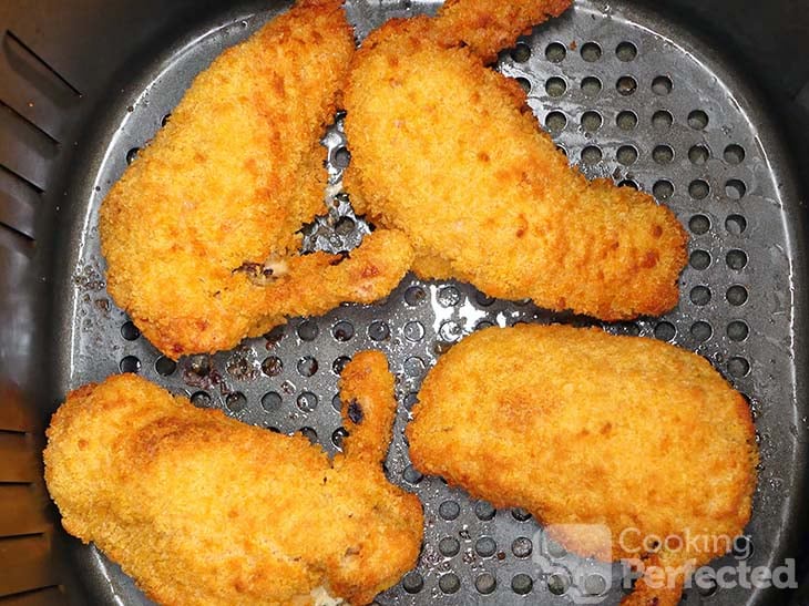 Frozen Chicken Kievs cooking in the Air Fryer