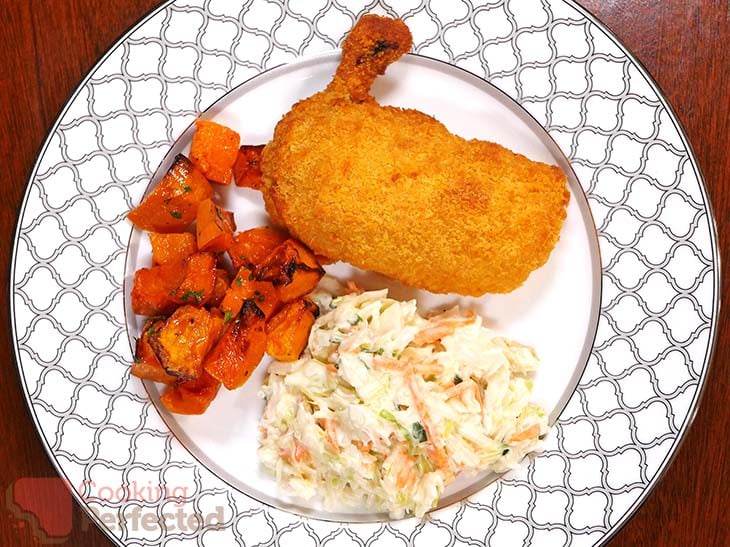 Air-Fried Frozen Chicken Kievs with coleslaw and roasted pumpkin