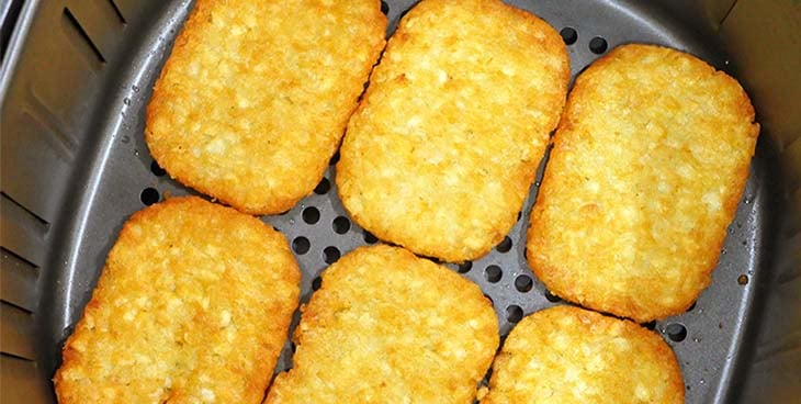 Frozen Hash Browns cooking in the Air Fryer
