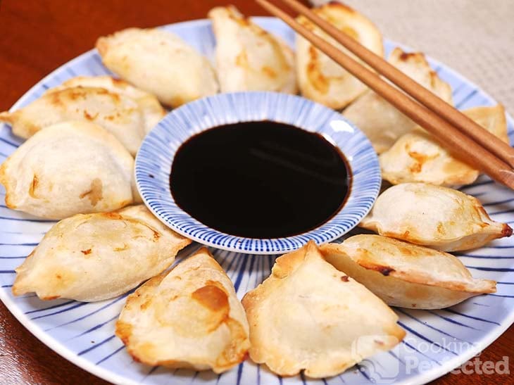 Air-fried dumplings served with soy sauce