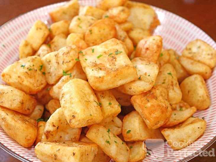 Air-fried frozen roast potatoes topped with chopped parsley