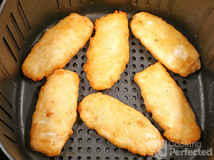 Frozen breaded fish in air outlet fryer