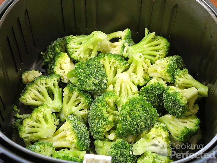 Frozen Broccoli in the Air Fryer ready for cooking